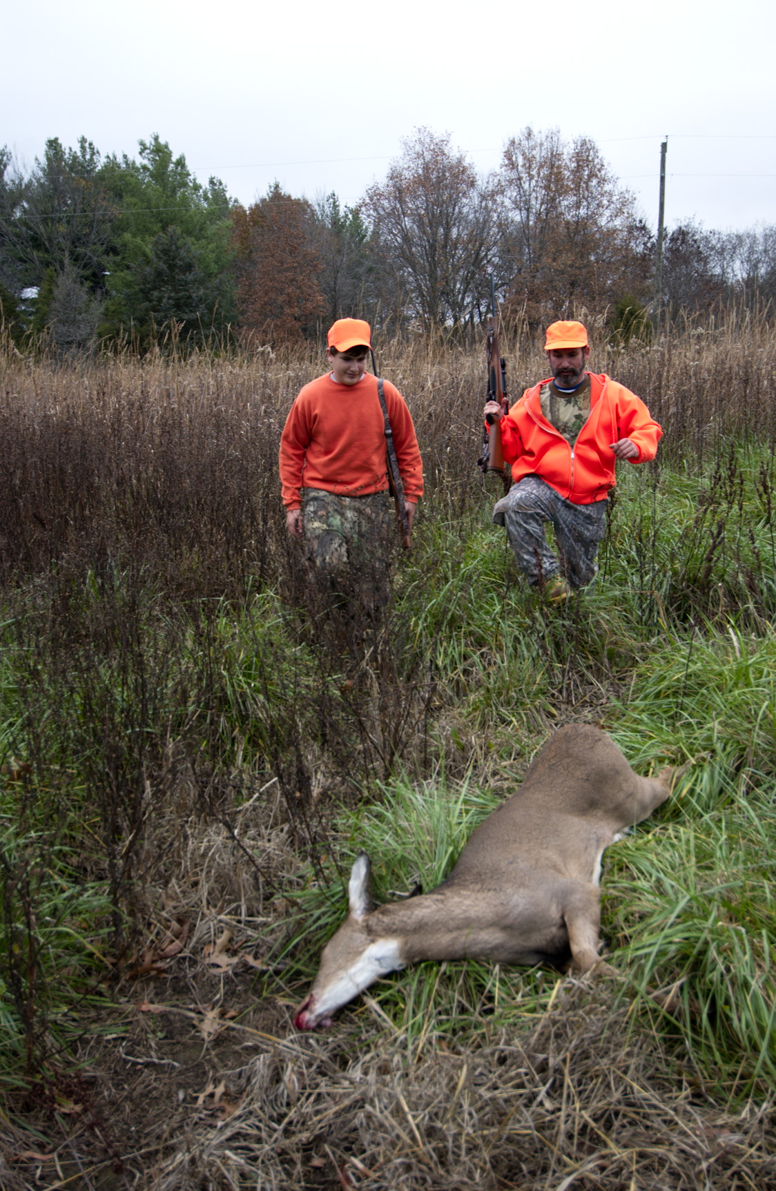 Hunters claim a deer during the urban portion of Missouri's firearms deer season