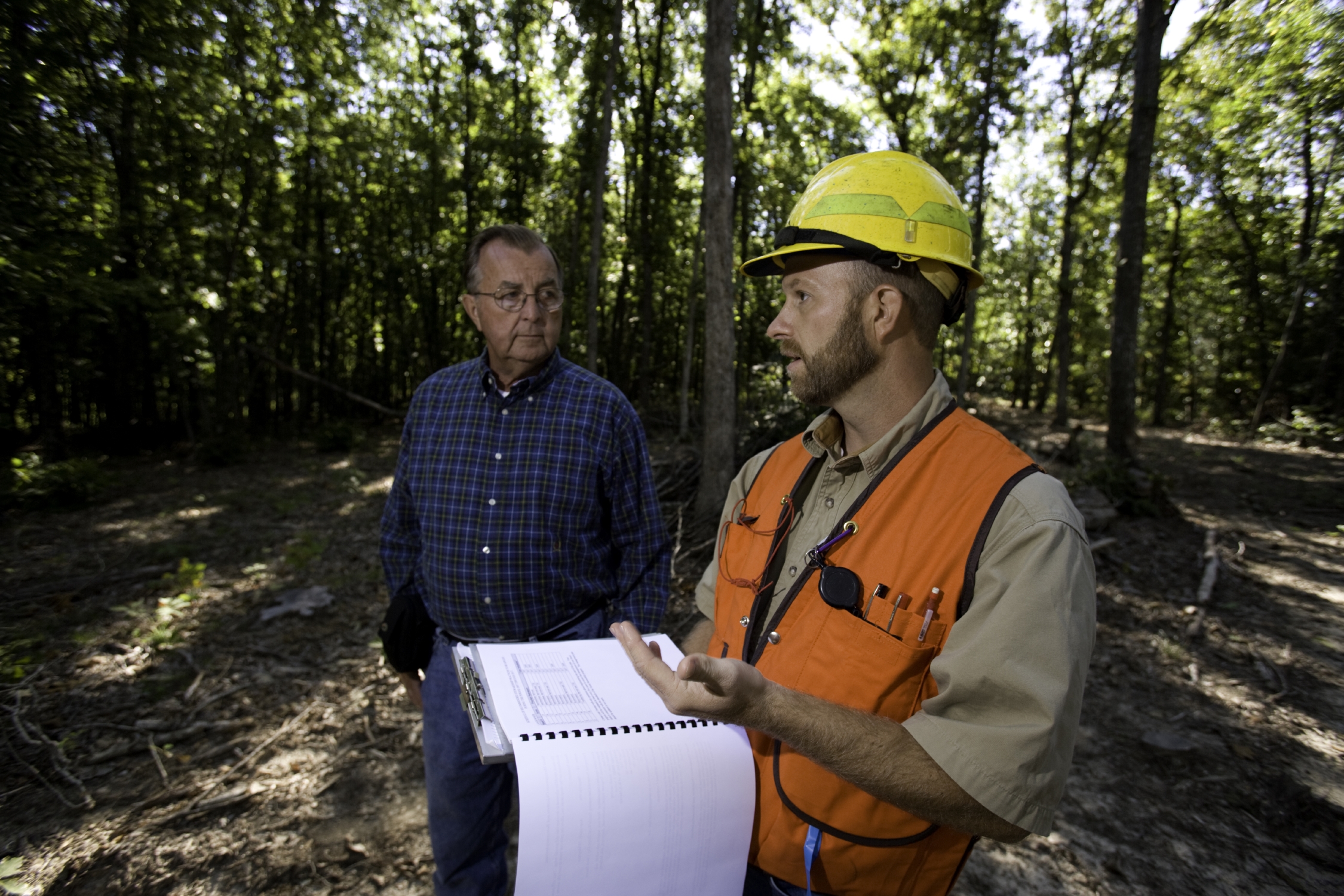 MDC Forester Aaron Holsapple gives advice to a landowner about managing woodland