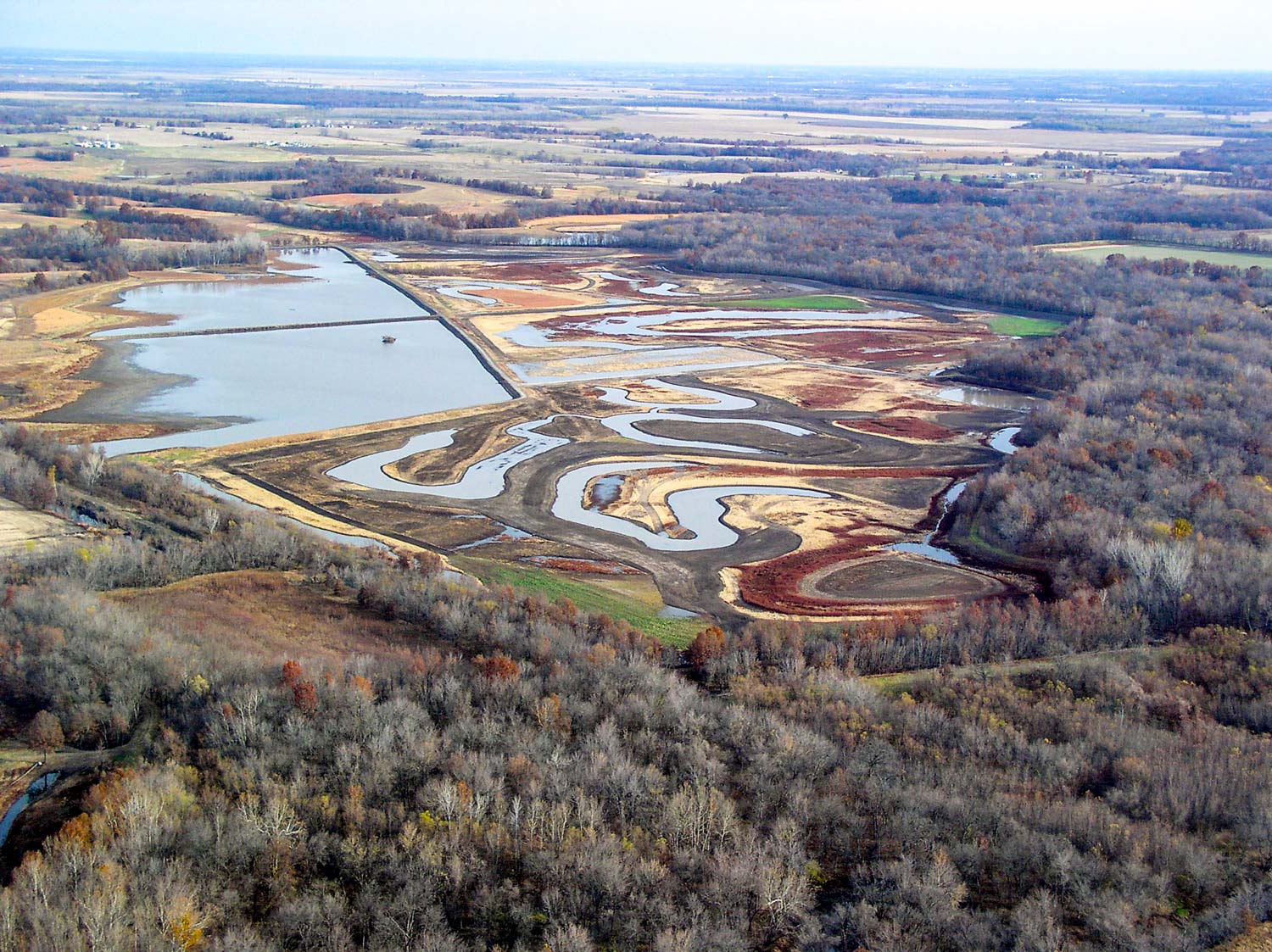 An aerial view of two forms of wetland management
