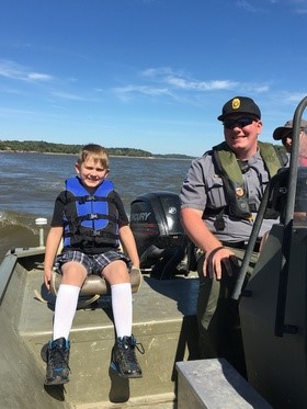 Kid and an agent riding on the Mississippi River