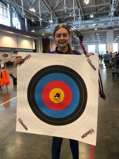 Savannah Sadler shows off her target during the NASP Open Tournament.