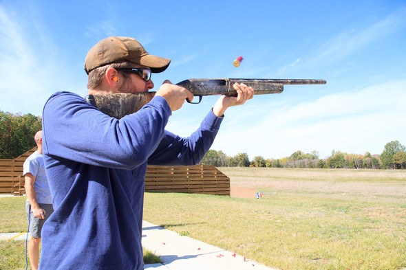 Man shooting shotgun at Busch Shooting Range