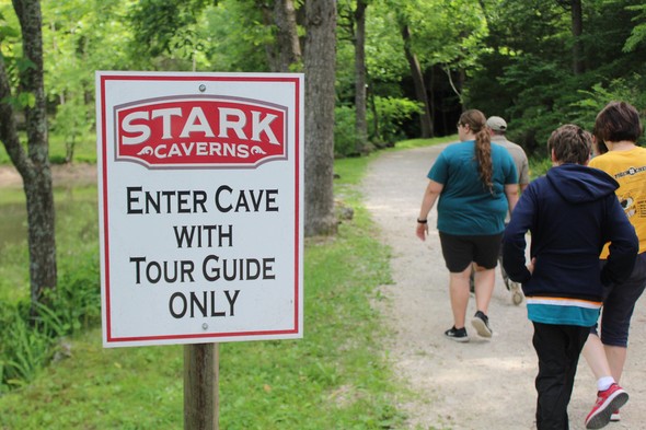 Visitors walk the path to Stark Caverns in Eldon.