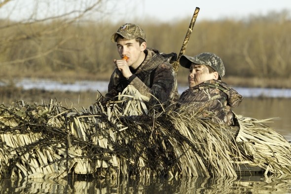 two young waterfowl hunters in blind