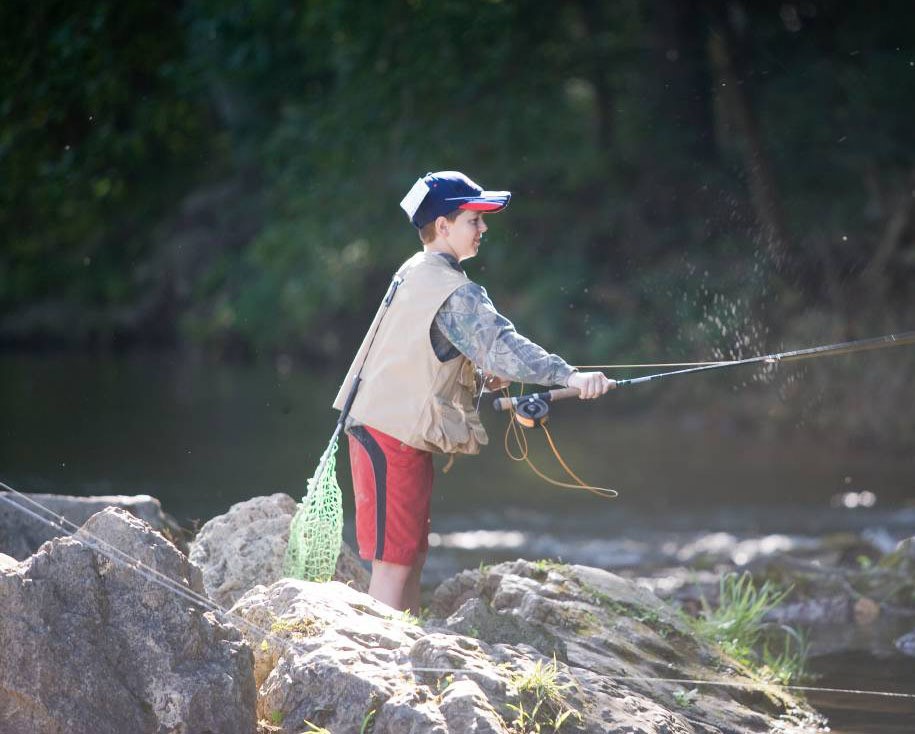A young boy casts his line at a Missouri fishing spot.