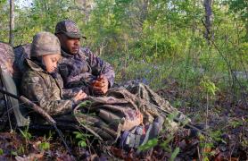 Father and daughter turkey hunting