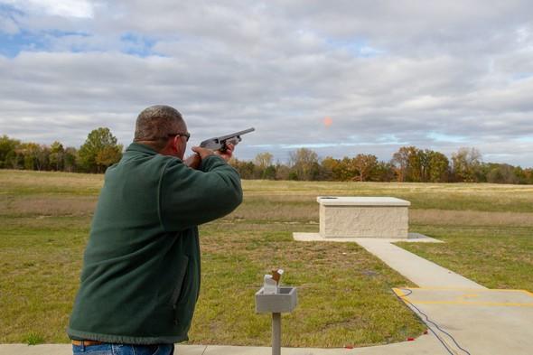 Man practices clay shooting at range