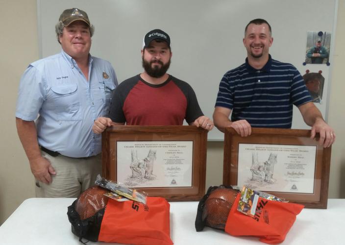 MDC Forester Gary Gognat with Loggers of the Year Chesley and Robert Neal of Winona.