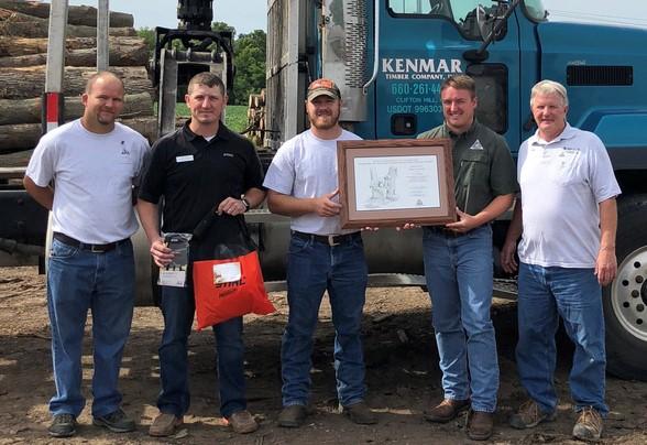 Orin Allen of Kenmar Timber Company in Clifton Hill receiving northeast regional logger of the year award.