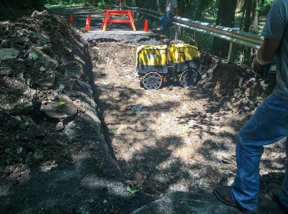 MDC crew trying to fill Rockwoods Reservation sinkhole.