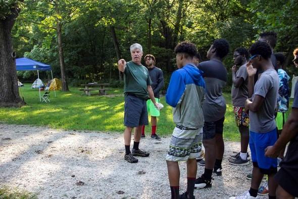 Urban Rangers receive instruction during their camping trip.