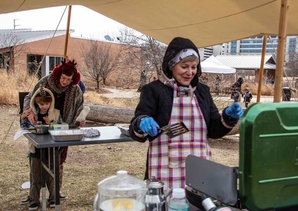 An MDC staff member cooks up some pancakes at the Urban Woodsman event.