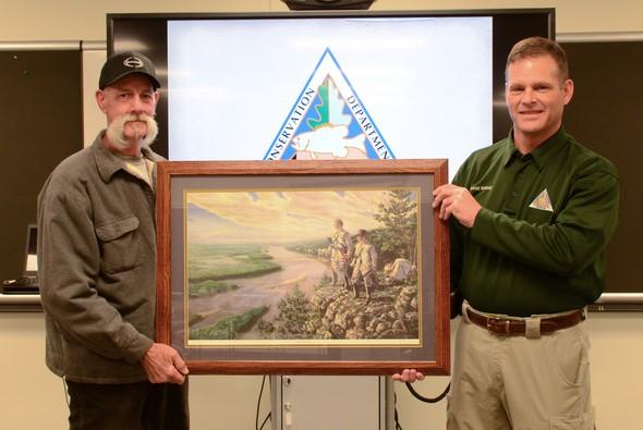 David Peters (left) is presented with the 2018 HED MDC Volunteer Instructor of the Year for the St. Louis Region Award by MDC Outdoor Skills Specialist Conrad Mallady