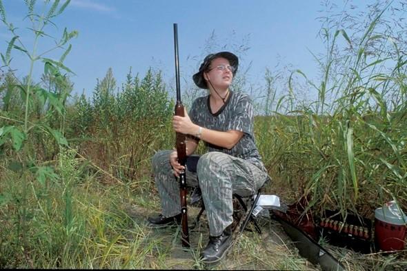 A dove hunter sits in wait for a dove.