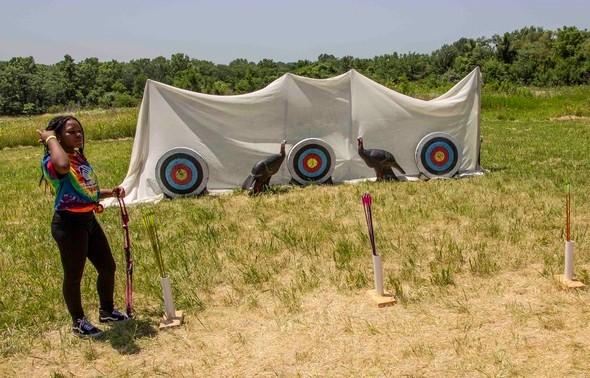 girl at archery range