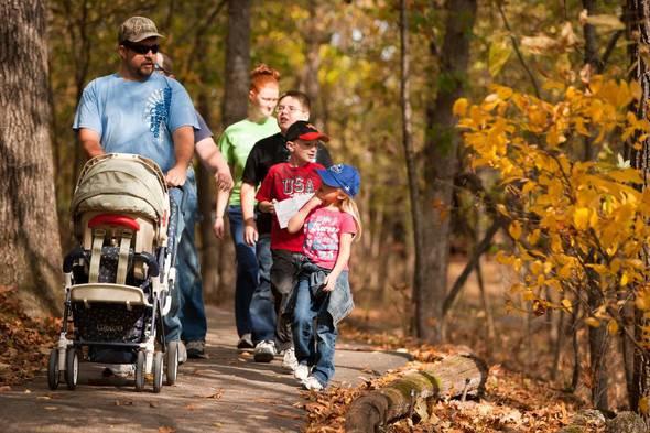 A family takes a nature walk at the Springfield Nature Center.