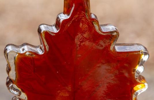 Syrup in maple leaf jar