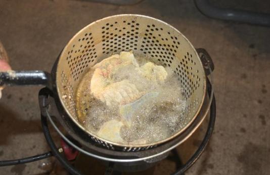 Sucker fillets in frying pan