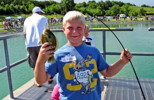 Boy holds sunfish