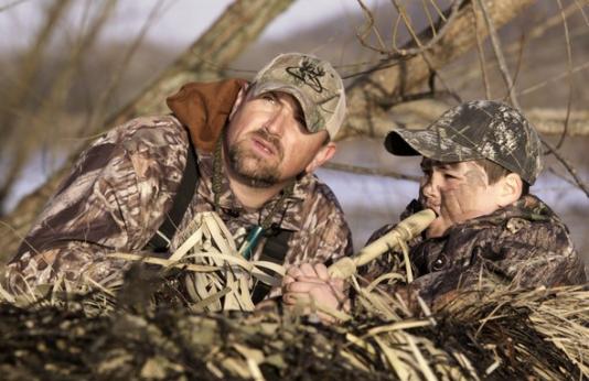 Father and son calling for waterfowl