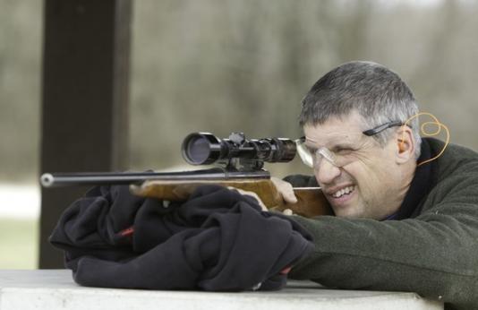 Man with rifle at shooting range