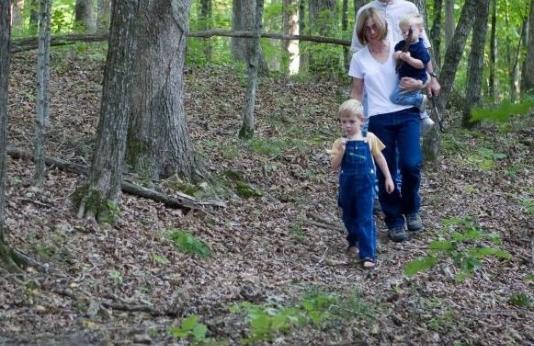family walking in woods