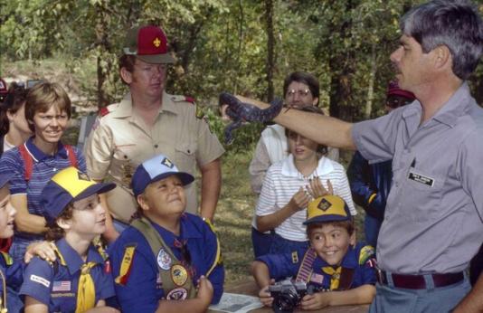 MDC staff member teaches Boy Scout group about reptiles