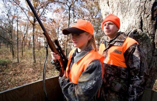 Father and daughter in a deer stand