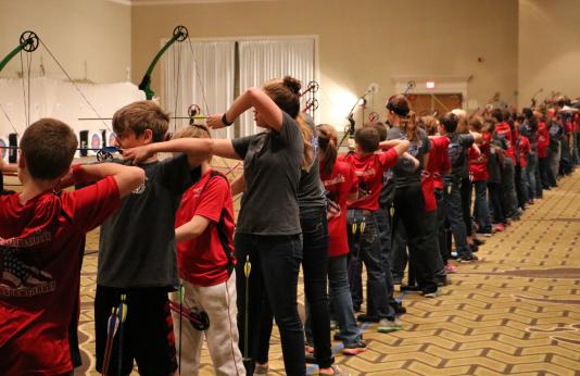 School-aged archers compete in a tournament