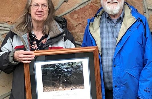 Cathy and Tom Aley holding MDC Master Conservationist award