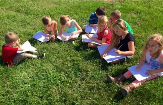 These young students enjoy learning about nature outside, through the Missouri Department of Conservation’s Discover Nature Schools program. 