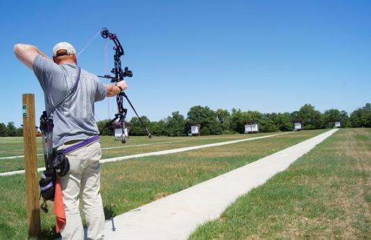 A man shoots archery at Frank Russell Recreation Area.