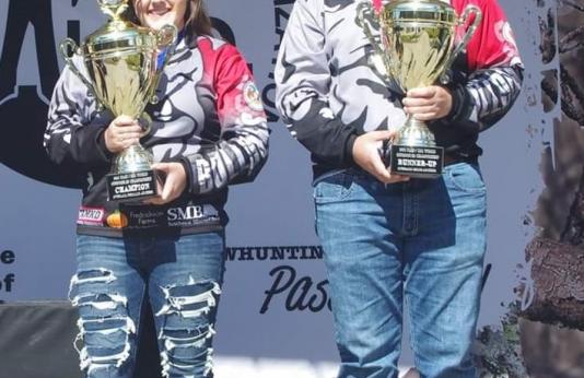 Ivy Walton and Jeremiah Jones pose with their trophies during the NASP/IBO Outdoor World Championship.