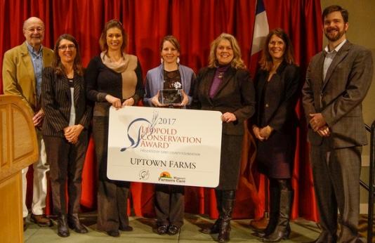 MDC Director Sara Parker Pauley presents the Leopold Conservation Award to Kate Lambert of Uptown Farms 