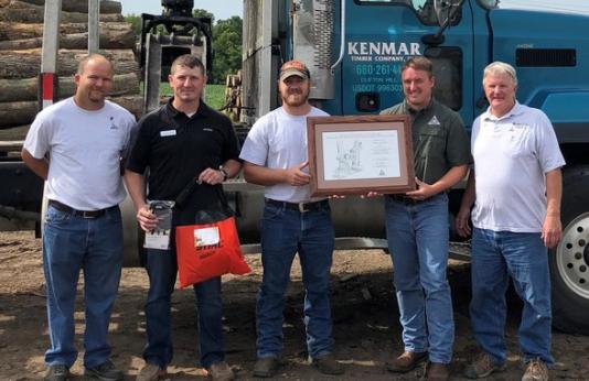 Orin Allen of Kenmar Timber Company in Clifton Hill receiving northeast regional logger of the year award.