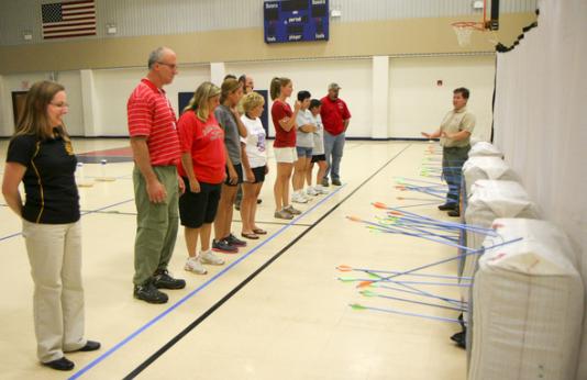 Teachers being trained to be archery instructors.