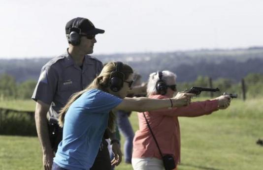 Woman shooting handgun at Women’s Firearms Workshop 