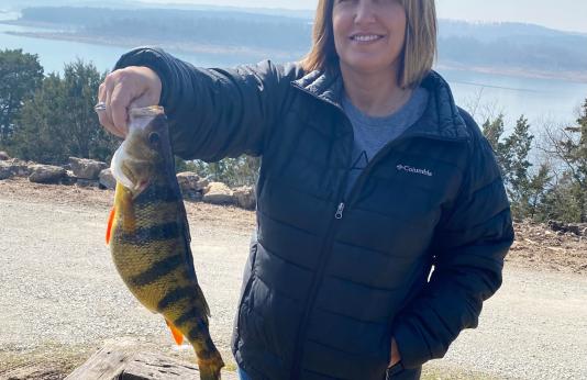 Sharon Christopher holds her state-record yellow perch.