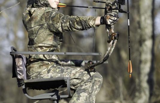 Youth archer in deer stand