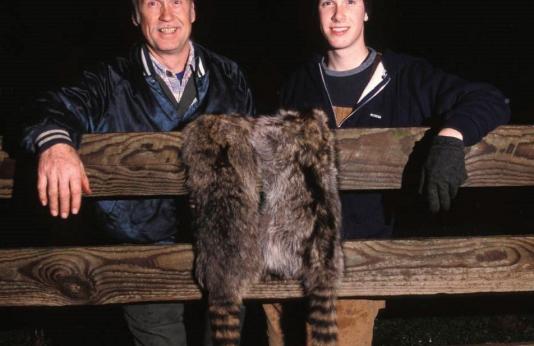 Men with raccoon pelt